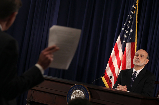 Federal Reserve Chairman Ben Bernanke listens to a question from a reporter during a press briefing at the Federal Reserve building on Wednesday.