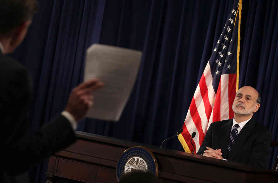 Federal Reserve Chairman Ben Bernanke listens to a question from a reporter during a press briefing at the Federal Reserve building on Wednesday.