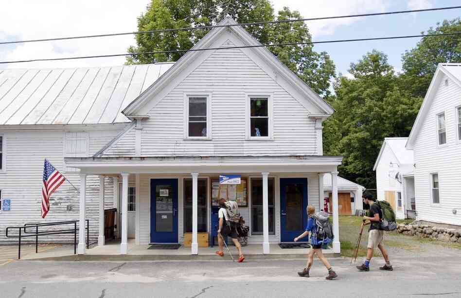 Hikers arrive at the post office in Caratunk, Maine, in 2011. Some of the rural post offices the U.S. Postal Service may close are relied on by Appalachian Trail hikers for supply drops on their trip from Georgia to Maine.