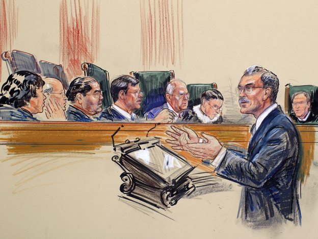 This artist rendering shows Solicitor General Donald Verrilli speaking before the Supreme Court. Verrilli argued Wednesday that Arizona's immigration law steps into federal territory.