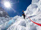 Conrad Anker descends an ice step in the Khumbu Icefall with a fixed rope. Conrad Anker descends an ice step in the Khumbu Icefall with a fixed rope.
