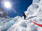Conrad Anker descends an ice step in the Khumbu Icefall with a fixed rope. Conrad Anker descends an ice step in the Khumbu Icefall with a fixed rope.