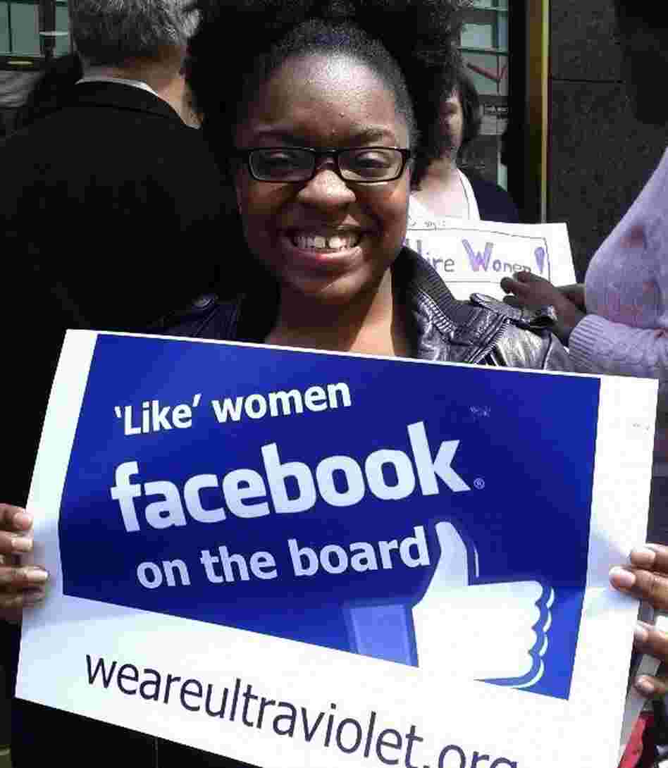 A protester holds a sign in front of Facebook's New York offices.