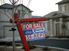 A sign stands in front of a bank-owned home in Las Vegas. Housing counselors say the $25 billion mortgage settlement between major banks and the states has yet to make an impact in communities around the U.S. A sign stands in front of a bank-owned home in Las Vegas. Housing counselors say the $25 billion mortgage settlement between major banks and the states has yet to make an impact in communities around the U.S.