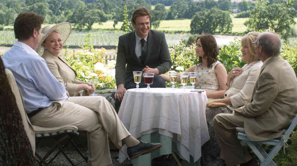 Tom (Jason Segel) and Violet (Emily Blunt) celebrate their impending nuptials with their families before Violet drops a bomb: She's been accepted at a program at the University of Michigan, and wants to move there and postpone their wedding day. Tom (Jason Segel) and Violet (Emily Blunt) celebrate their impending nuptials with their families before Violet drops a bomb: She's been accepted at a program at the University of Michigan, and wants to move there and postpone their wedding day.
