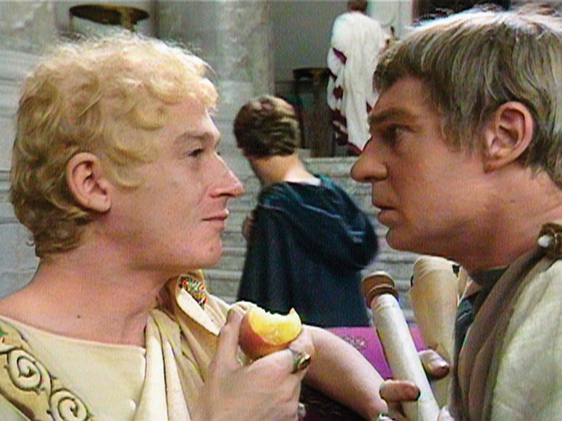 John Hurt (Caligula) and Derek Jacobi (Claudius) square off in the miniseries I, Claudius.