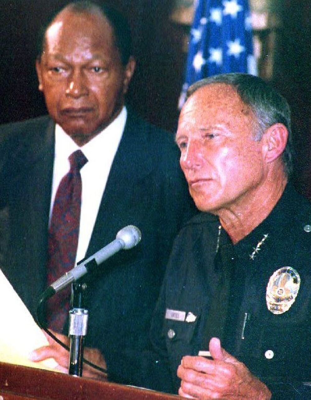 LAPD Chief Daryl Gates (right) and Los Angeles Mayor Tom Bradley respond to the rioting that began on April 30, 1992, after four police officers were acquitted in the beating of Rodney King.