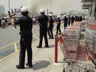 Los Angeles police form a line to keep a crowd from entering a building on April 30, 1992. Twenty years after the L.A. riots, most civil rights and community groups give the LAPD high marks for progress. Los Angeles police form a line to keep a crowd from entering a building on April 30, 1992. Twenty years after the L.A. riots, most civil rights and community groups give the LAPD high marks for progress.
