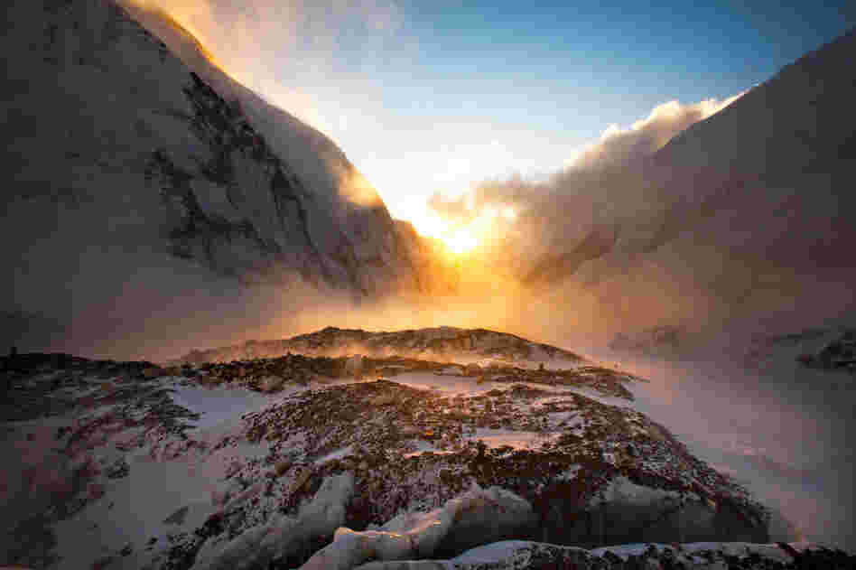 The sun sets over the west shoulder of Everest (right) and Nuptse, a neighboring peak, April 24.