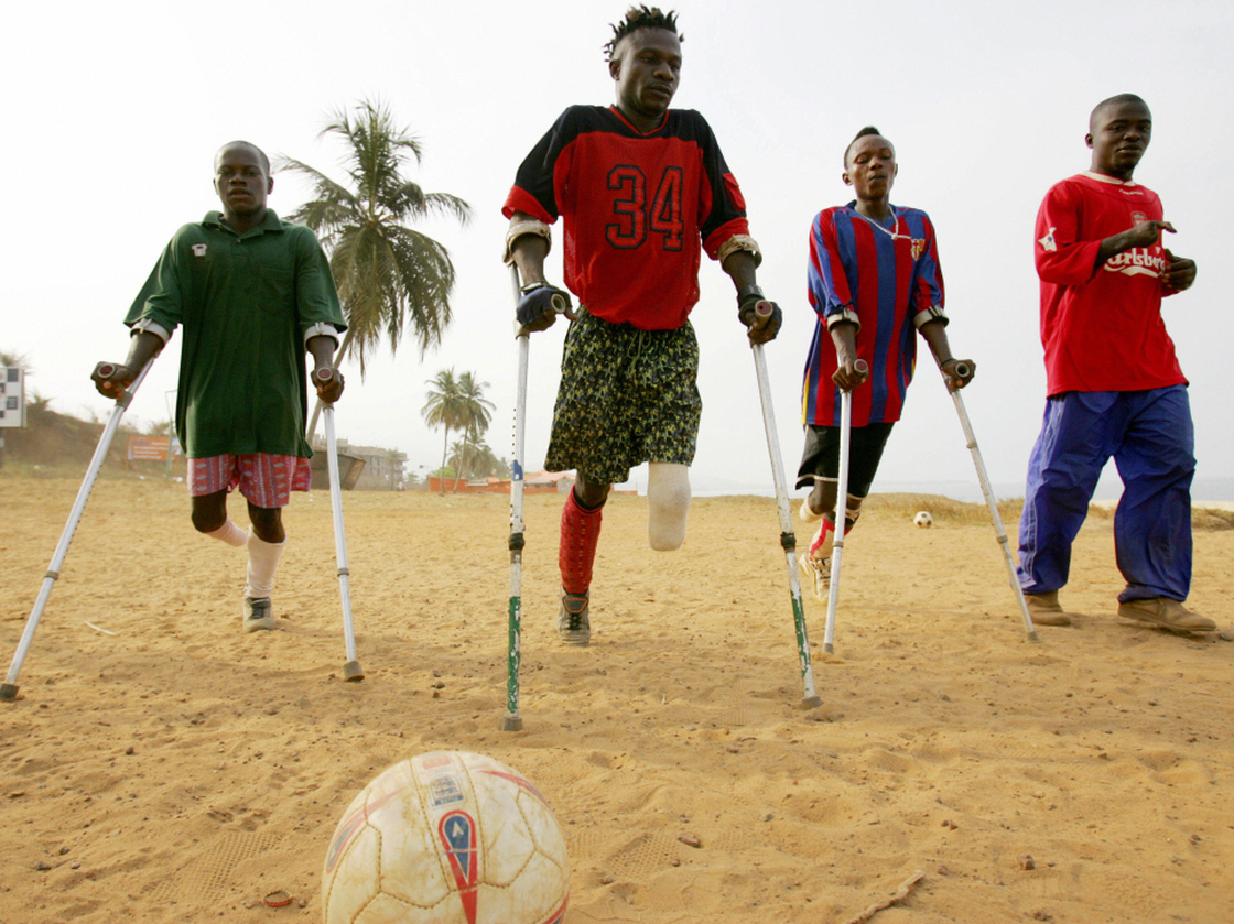 Members of a civil war amputee soccer team practice on a beach in Freetown, Sierra Leone's capital, in April 2006. Rebel groups, allegedly aided by former Liberian President Charles Taylor during Sierra Leone's brutal 1991-2002 civil war, were known for their gruesome practice of hacking off limbs.