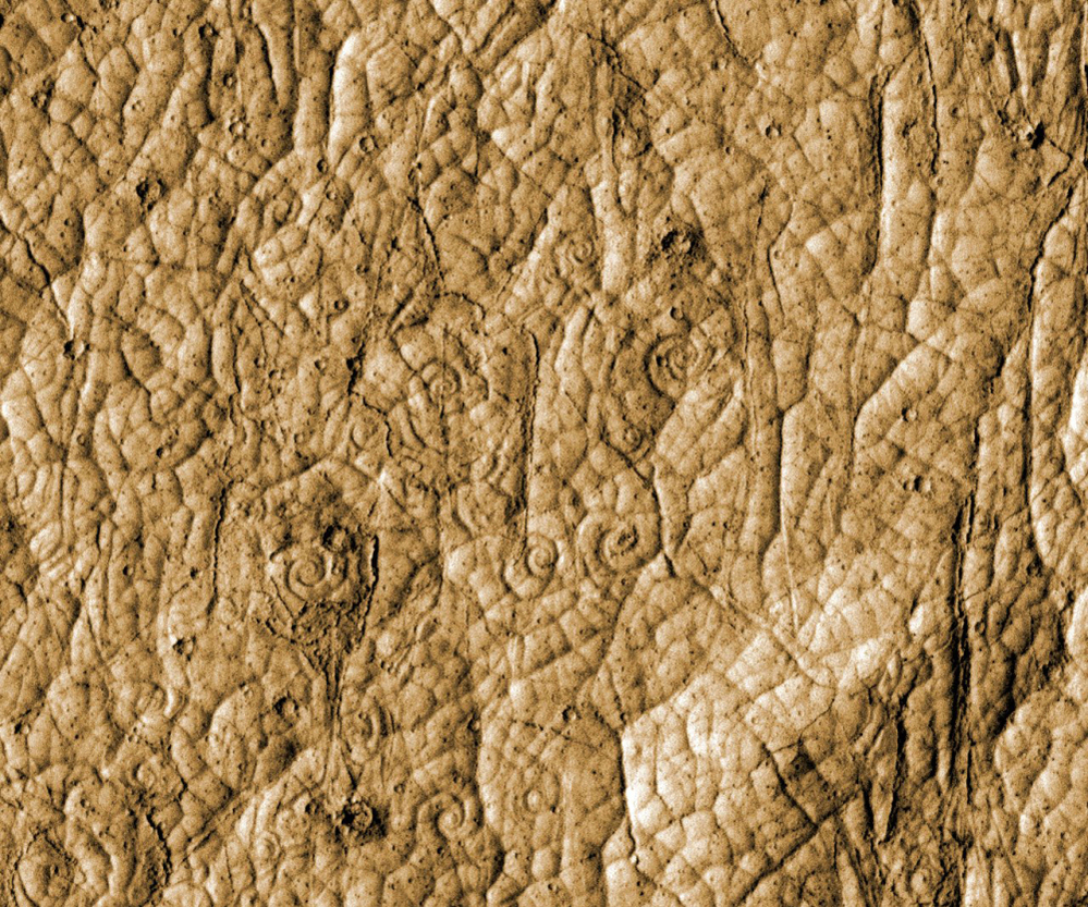 This image provided by NASA shows lava flows in the shape of coils located near the equatorial region of Mars.
