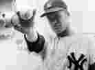 New York Yankees pitcher Jim Bouton holds two balls that his teammates hope will lead them to victory in the 1964 World Series.