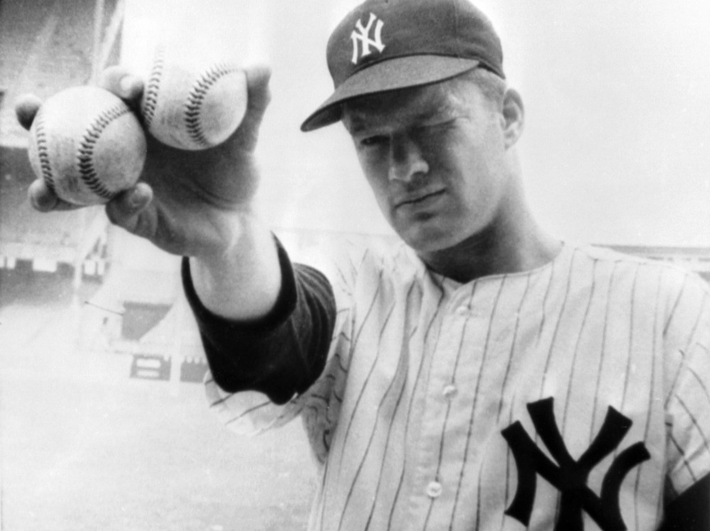 New York Yankees pitcher Jim Bouton holds two balls that his teammates hope will lead them to victory in the 1964 World Series.