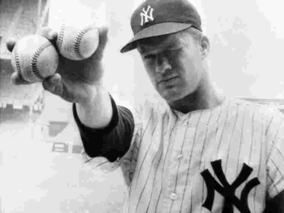 New York Yankees pitcher Jim Bouton holds two balls that his teammates hope will lead them to victory in the 1964 World Series.