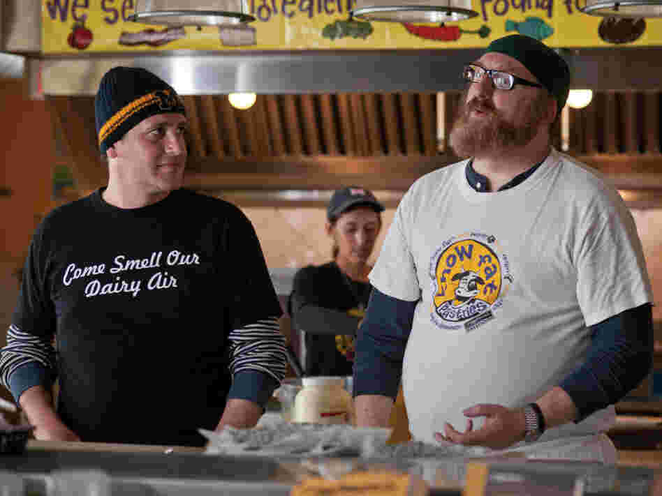 Tom makes the best of the relocation by making unlikely friends like Tarquin (Brian Posehn) and trying to find work as a chef — while in the meantime putting in time at Ann Arbor's famed Zingerman's Deli. Tom makes the best of the relocation by making unlikely friends like Tarquin (Brian Posehn) and trying to find work as a chef — while in the meantime putting in time at Ann Arbor's famed Zingerman's Deli.