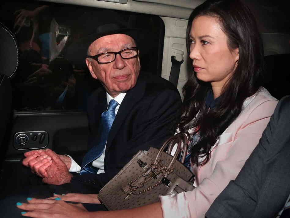 Rupert Murdoch and his wife, Wendi Deng Murdoch, as they were being driven away from the Royal Courts of Justice following his testimony today in London.