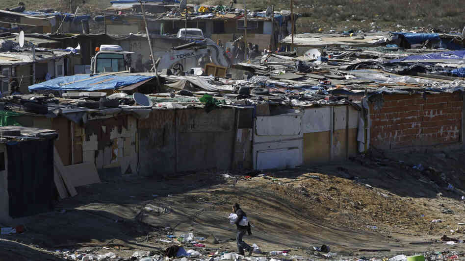 A digger demolishes a shack as a boy walks nearby in one section of the sprawling Cañada Real slum on the outskirts of Madrid on March 5. After decades of turning a blind eye to Europe's largest illegal settlement, cash-strapped authorities are demolishing homes there and taking back the land. A digger demolishes a shack as a boy walks nearby in one section of the sprawling Cañada Real slum on the outskirts of Madrid on March 5. After decades of turning a blind eye to Europe's largest illegal settlement, cash-strapped authorities are demolishing homes there and taking back the land.