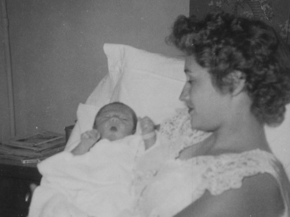 Patricia Morton cradles her son Michael in 1954.