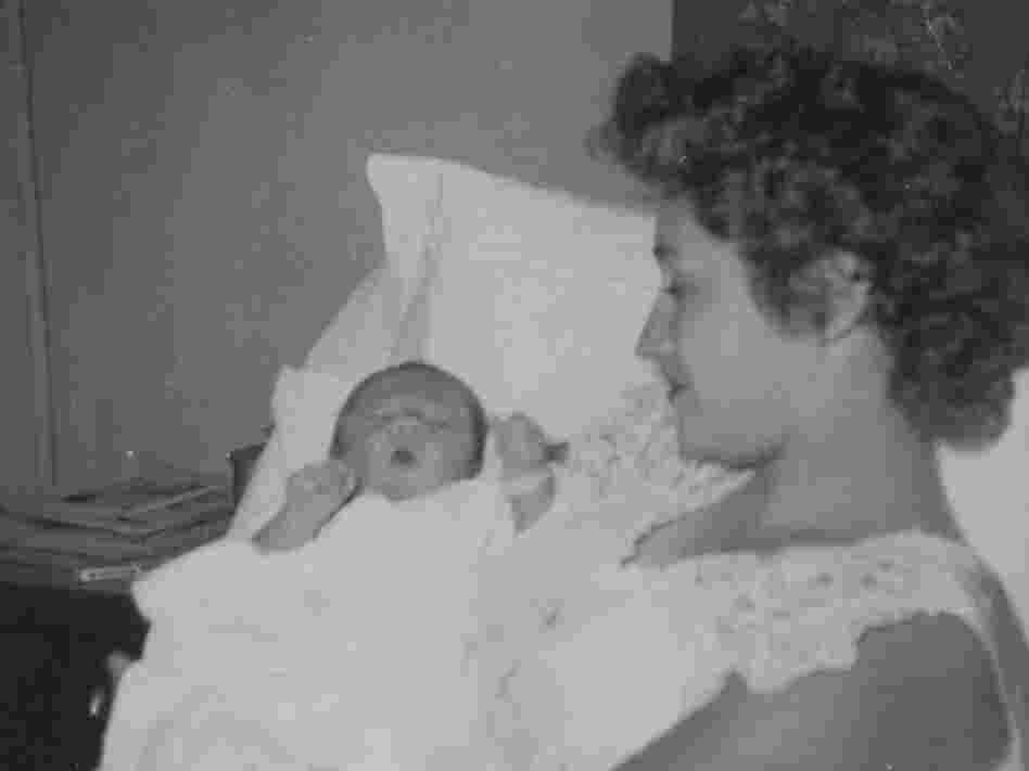 Patricia Morton cradles her son Michael in 1954.