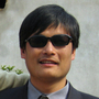 Blind activist Chen Guangcheng with his wife and son outside their home in northeast China's Shandong province in 2005.