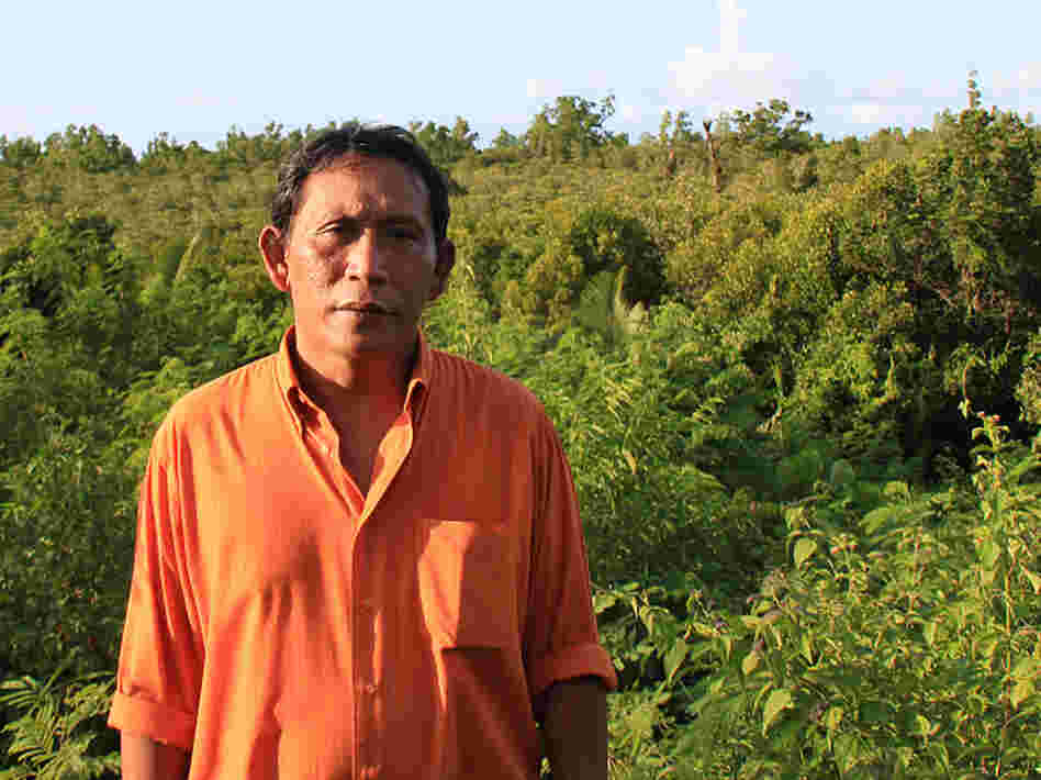 Rignolda Jamaluddin, a local marine scientist, stands in front of the mangrove forests of North Sulawesi that he has worked to rebuild over the past two decades. Part of his strategy included educating villagers on ways they would benefit from not cutting down the trees, such as making alcohol, sugar and furniture from the trees.