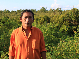 Rignolda Jamaluddin, a local marine scientist, stands in front of the mangrove forests of North Sulawesi that he has worked to rebuild over the past two decades. Part of his strategy included educating villagers on ways they would benefit from not cutting down the trees, such as making alcohol, sugar and furniture from the trees. Rignolda Jamaluddin, a local marine scientist, stands in front of the mangrove forests of North Sulawesi that he has worked to rebuild over the past two decades. Part of his strategy included educating villagers on ways they would benefit from not cutting down the trees, such as making alcohol, sugar and furniture from the trees.