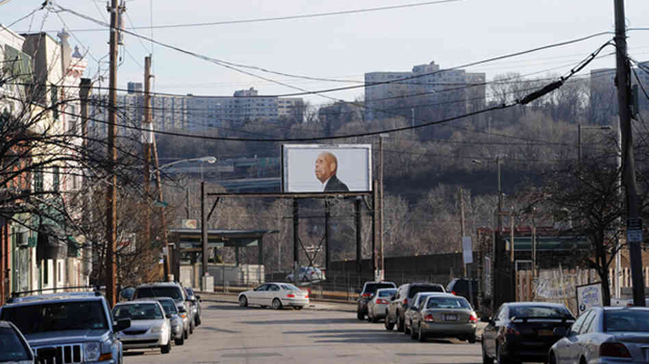 A distant billboard with Strauss' photo of Nathaniel J. Jordan