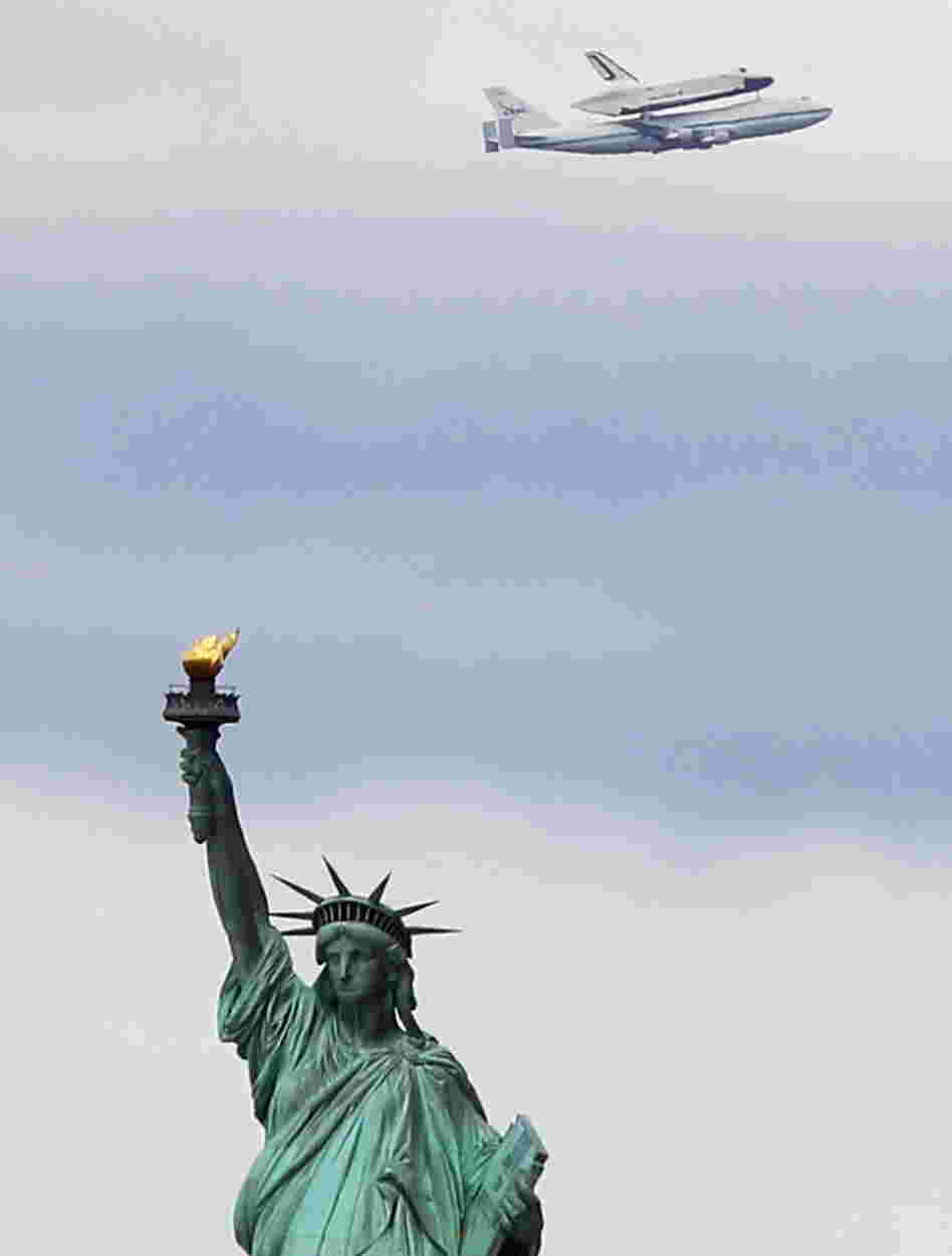 Riding atop a 747 shuttle carrier aircraft, the space shuttle Enterprise flew past the Statue of Liberty in New York Harbor today.
