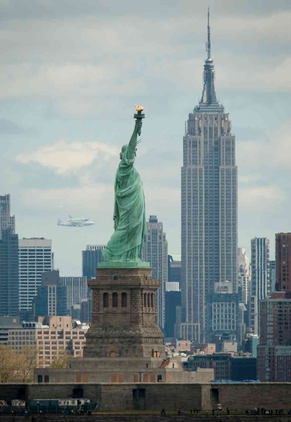 Another view, capturing Enterprise, the Statue of Liberty and the Empire State Building.