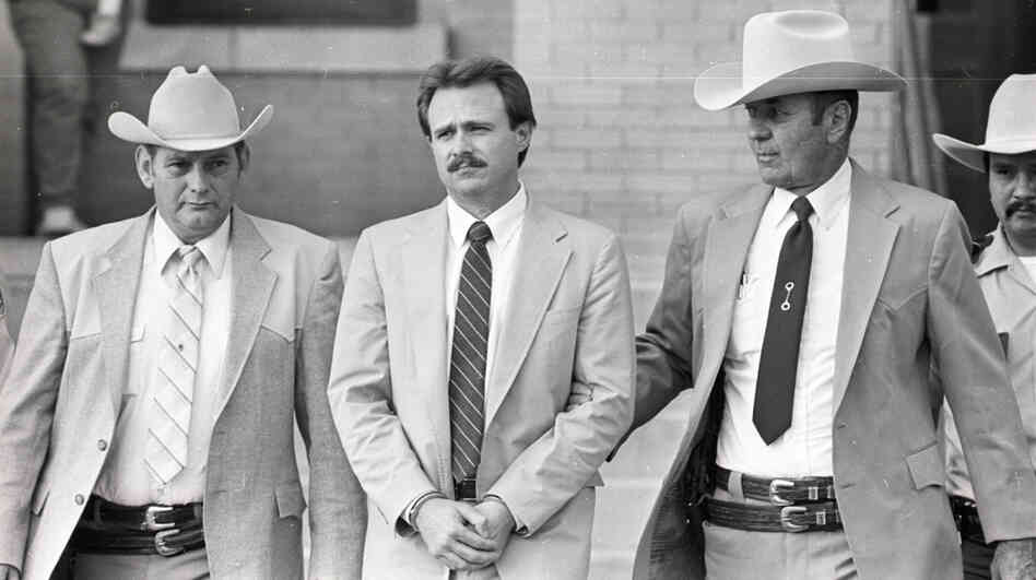 Michael Morton is taken back to jail in February 1987 by Sgt. Don Wood (left) and Sheriff Jim Boutwell (right) after he was convicted of his wife's murder.