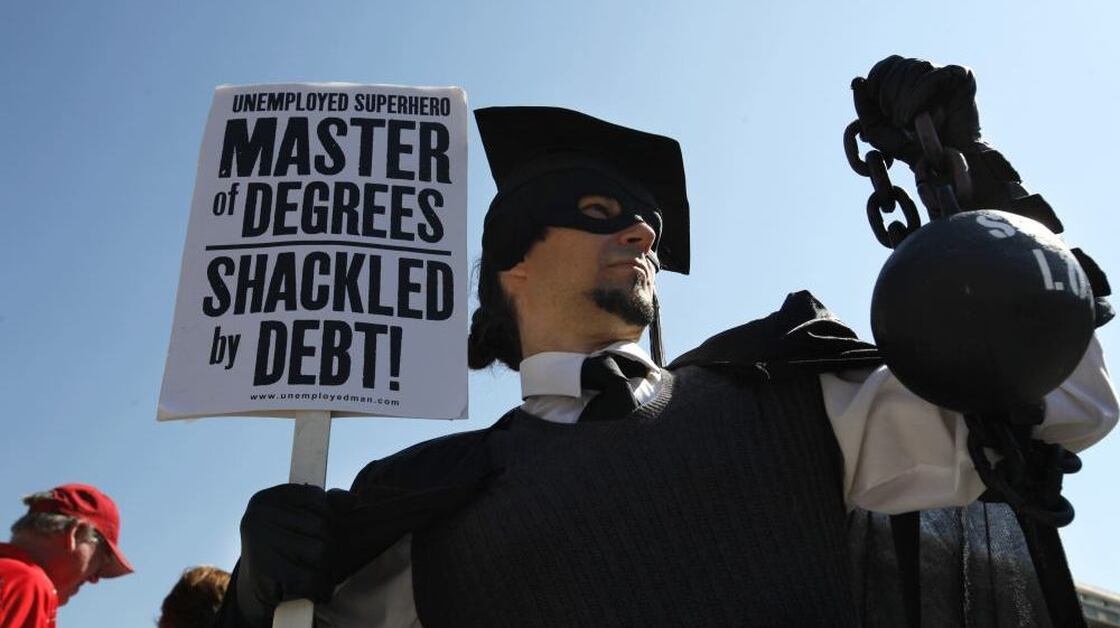 Gan Golan of Los Angeles, dressed as the "Master of Degrees," holds a ball and chain representing his college loan debt during Occupy D.C. activities in Washington. Average in-state tuition and fees at four-year public colleges rose an additional $631 this fall, or 8.3 percent, compared with a year ago.
