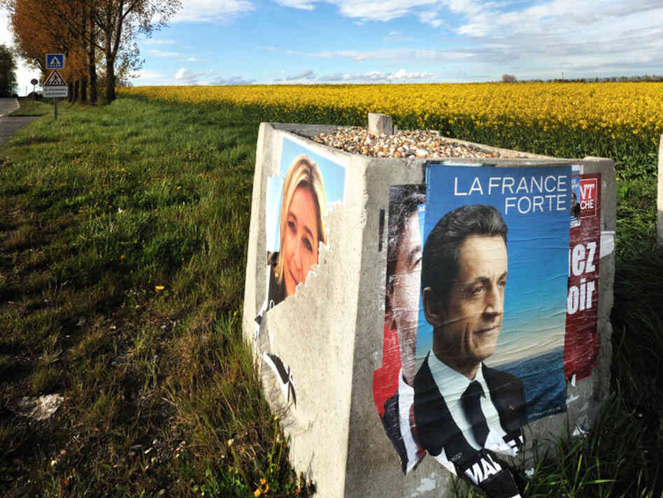 A campaign poster for French President Nicolas Sarkozy stands next to a torn poster of National Front candidate Marine Le Pen in northern France. Sarkozy needs Le Pen's far-right voters if he is to win the runoff election on Sunday. A campaign poster for French President Nicolas Sarkozy stands next to a torn poster of National Front candidate Marine Le Pen in northern France. Sarkozy needs Le Pen's far-right voters if he is to win the runoff election on Sunday.