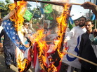 April 13: In Karachi, activists from the Shabab-e-Milli group set fire to U.S. flags during a protest against the reopening of the NATO supply route to Afghanistan. April 13: In Karachi, activists from the Shabab-e-Milli group set fire to U.S. flags during a protest against the reopening of the NATO supply route to Afghanistan.