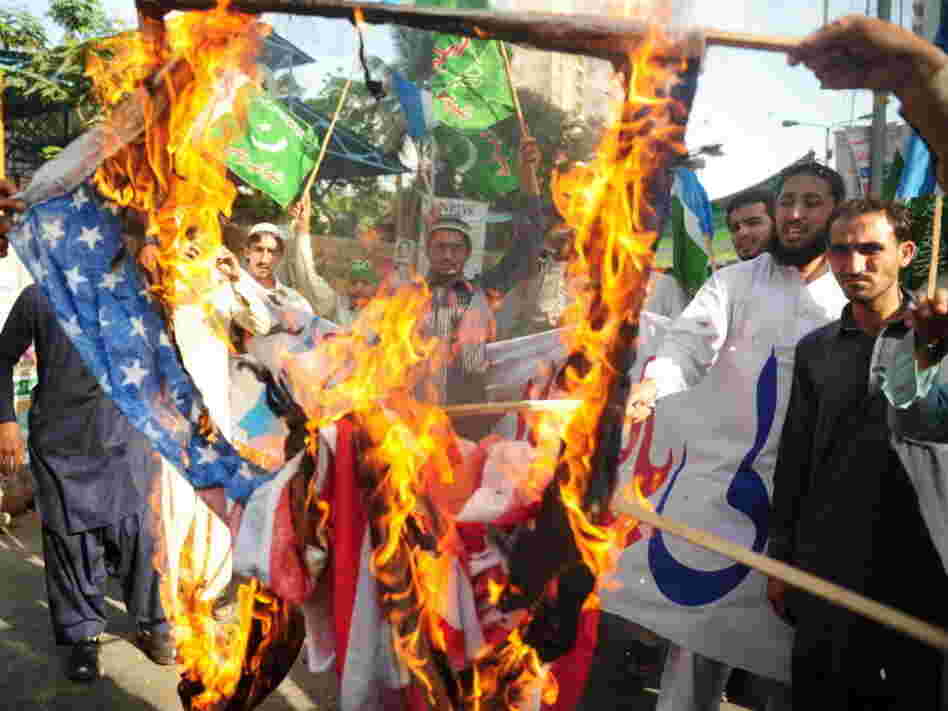 April 13: In Karachi, activists from the Shabab-e-Milli group set fire to U.S. flags during a protest against the reopening of the NATO supply route to Afghanistan.