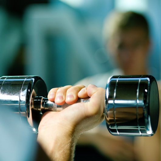 You don't have to lift heavy weights to build muscles. More reps with lighter weights works.