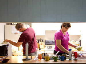 Teresa MacBain makes breakfast for her son David, 22, while he is home on leave from serving in the Army. MacBain says she is still adjusting to life outside the church.