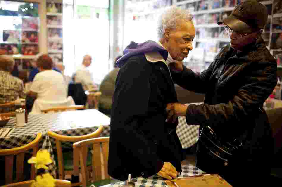 Yolanda zips up Ida's coat after taking her out to breakfast on her 89th birthday.