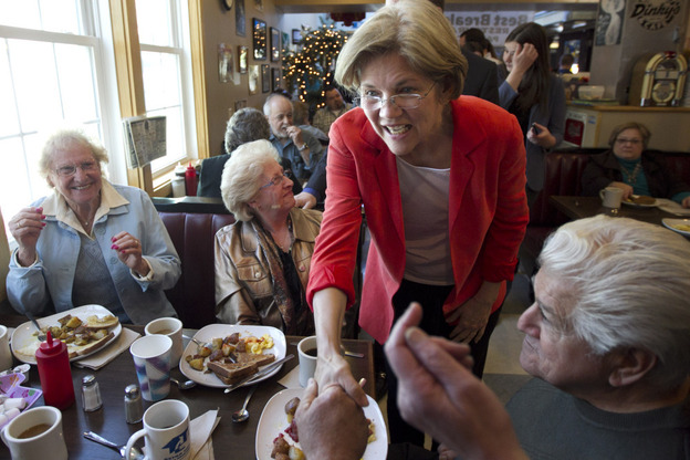 U.S. Senate candidate Elizabeth Warren, a Democrat, greets people at Dinky's Blue Belle Diner in Shrewsbury, Mass., on Sunday.