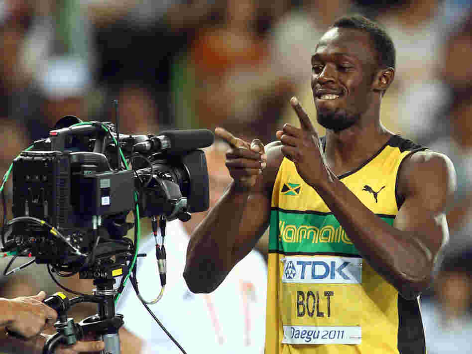 Many track fans watched online four years ago, as sprinter Usain Bolt set a world record at the Beijing Olympics. This year, NBC will stream video of all 302 events online. And Bolt, seen here showing his appreciation for video in 2010, will try to repeat his feat.