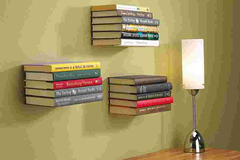 Conceal Shelf: These shelves appear to defy gravity. Hooks hold the cover of the bottom book to screen the metal plate that bears the weight.