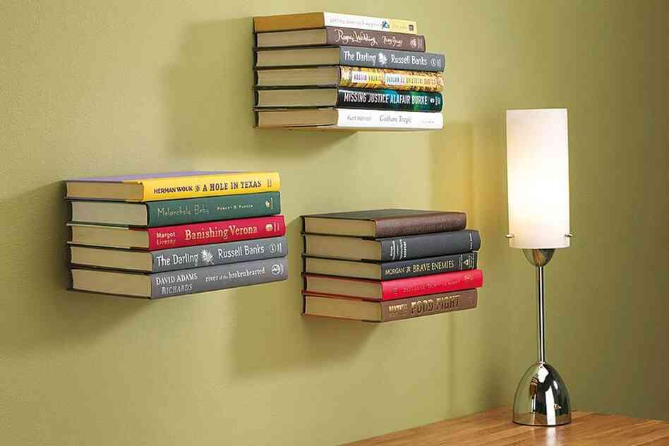 Conceal Shelf: These shelves appear to defy gravity. Hooks hold the cover of the bottom book to screen the metal plate that bears the weight.