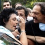 Communist Party of Greece lawmaker Liana Kanelli enters her car after protesters threw yogurt at her as she tried to reach the Greek Parliament on June 29, during a 48-hour general strike in Athens. Such attacks are not uncommon in Greece, where ordinary Greeks' anger over the debt crisis and austerity measures is boiliing over.