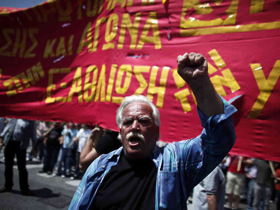 A protester shouts slogans during a May Day protest in Athens on Tuesday. In debt-crippled Greece, more than 2,000 people marched through central Athens in subdued protests centered on the country's harsh austerity program, ahead of elections scheduled for May 6.