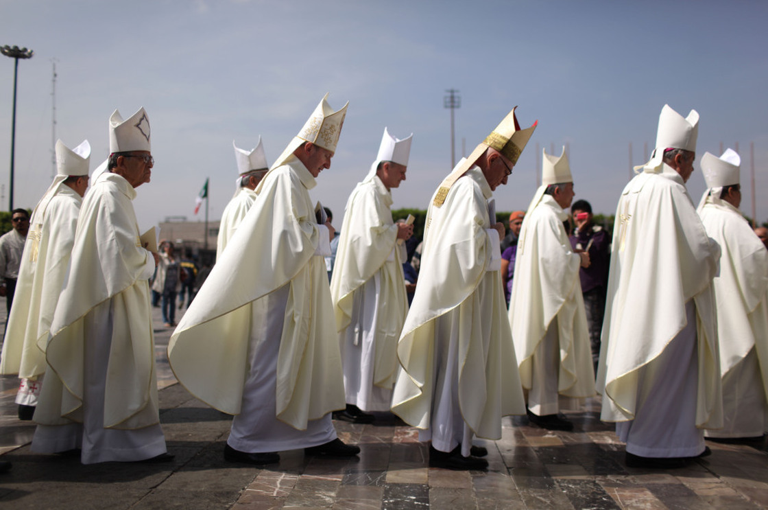 Priests stand prior to the beatification ceremony for the late sister Maria Ines Teresa Arias outside the Basilica of Our Lady of Guadalupe in Mexico City in April.