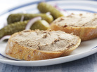 Pate spread on bread, with cornichons Pate spread on bread, with cornichons