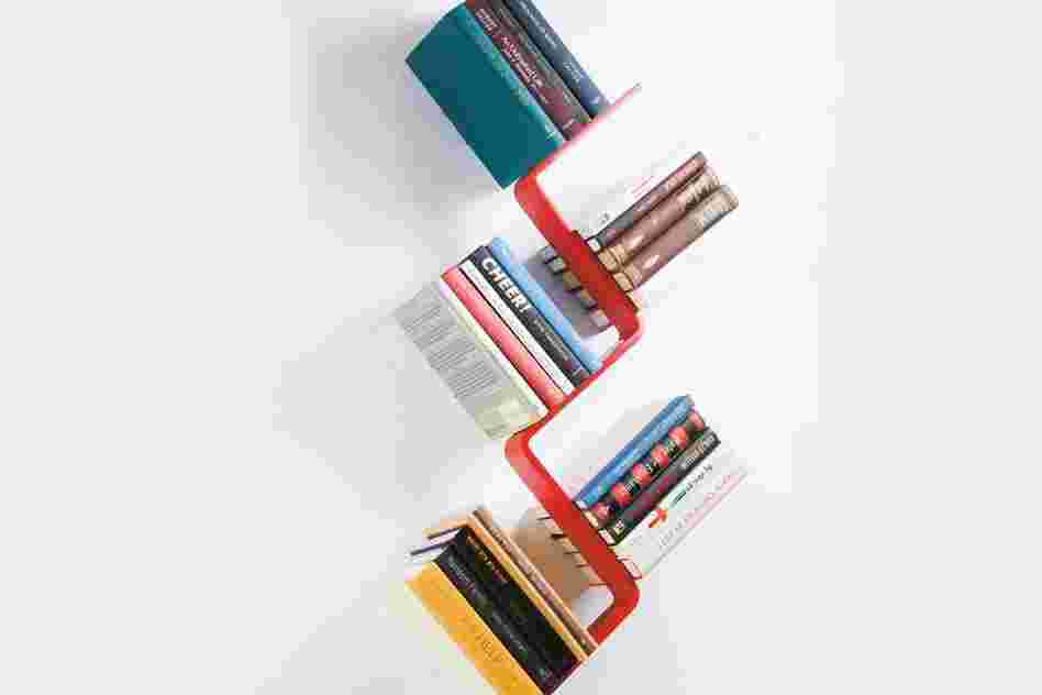 Z Shelf: The Z Shelf seems to hold books at impossible angles. Two tiny hooks hold the lower cover of the bottom book, rendering the shelf inside invisible.