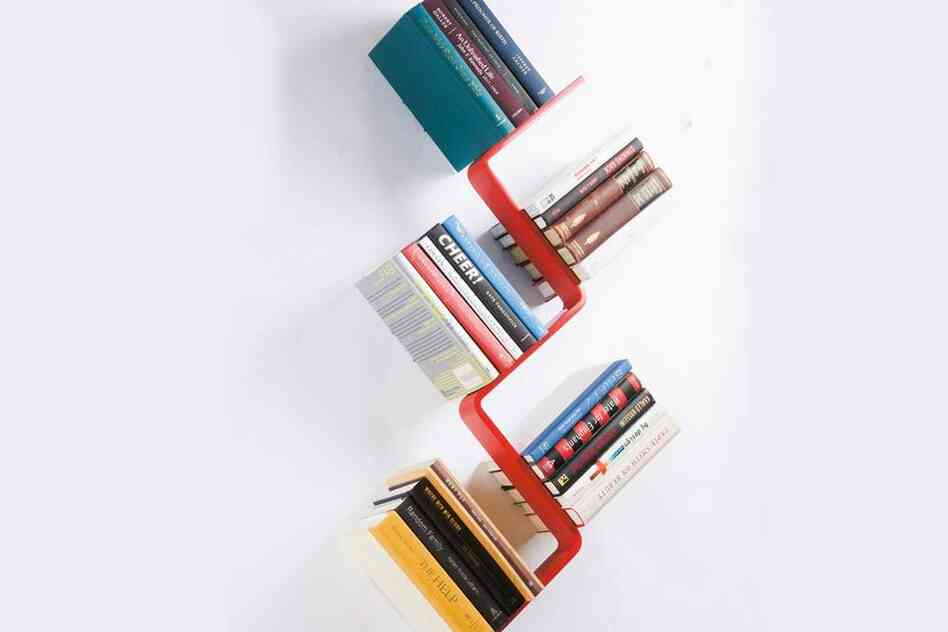 Z Shelf: The Z Shelf seems to hold books at impossible angles. Two tiny hooks hold the lower cover of the bottom book, rendering the shelf inside invisible.