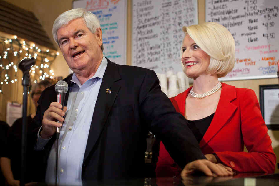 With his wife, Callista, Gingrich speaks at Adams Street Espresso on Dec. 30, 2011, in Creston, Iowa. 
