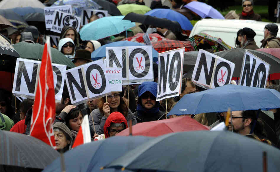 People attend a demonstration in Madrid organized by unions against financial cuts in health and education on April 29.