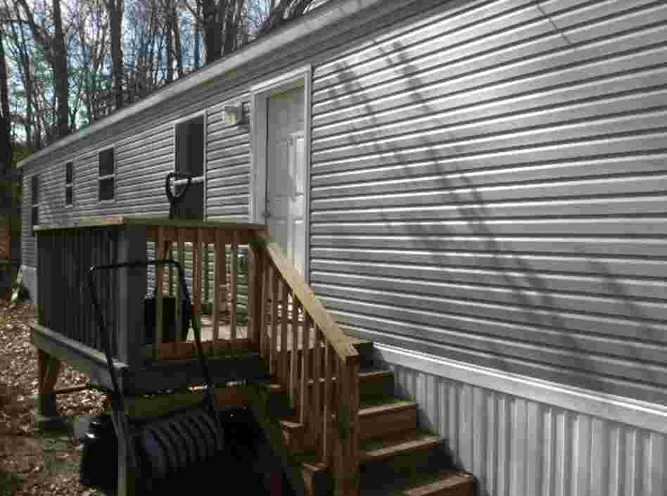 Co-op resident Gary Thulin had almost no credit when a nonprofit lender approved him for a loan to replace the single-wide home he had nicknamed "The Dump" with this new model.